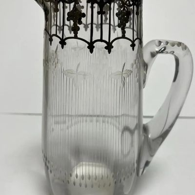 Sale Photo Thumbnail #161: Antique Silver Overlay Early Etched Leaded Glass Pitcher 9-3/4" Tall in VG Preowned Condition. $15 Domestic Shipping.