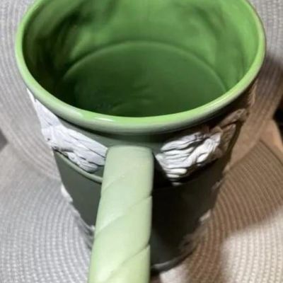 Sale Photo Thumbnail #180: Antique Sage Green Unmarked Base Jasperware Large Pitcher 9" Tall in VG Preowned Condition. $15 DOMESTIC INHOUSE SHIPPING.