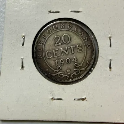 Sale Photo Thumbnail #555: SCARCE NEWFOUNDLAND 1904-H CIRCULATED CONDITION 20 CENT SILVER COIN AS PICTURED. $5 DOMESTIC SHIPPING.