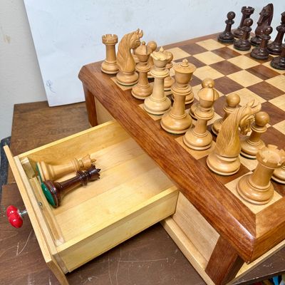 Sale Photo Thumbnail #106: Large size, pieces are 3"to 4" tall. Wooden board is approx. 18" x 18". and approx. 5" tall. Small drawer in the center to hold smaller game pieces, the chess pieces shown look to be from ChessHouse.com and have cloth storage bags.  There is an extra Quee