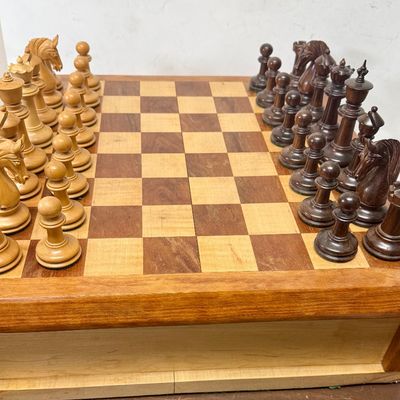 Sale Photo Thumbnail #104: Large size, pieces are 3"to 4" tall. Wooden board is approx. 18" x 18". and approx. 5" tall. Small drawer in the center to hold smaller game pieces, the chess pieces shown look to be from ChessHouse.com and have cloth storage bags.  There is an extra Quee