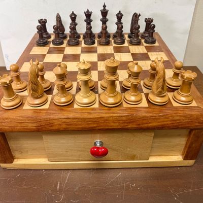 Sale Photo Thumbnail #107: Large size, pieces are 3"to 4" tall. Wooden board is approx. 18" x 18". and approx. 5" tall. Small drawer in the center to hold smaller game pieces, the chess pieces shown look to be from ChessHouse.com and have cloth storage bags.  There is an extra Quee