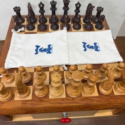 Sale Photo Thumbnail #111: Large size, pieces are 3"to 4" tall. Wooden board is approx. 18" x 18". and approx. 5" tall. Small drawer in the center to hold smaller game pieces, the chess pieces shown look to be from ChessHouse.com and have cloth storage bags.  There is an extra Quee