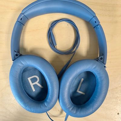Sale Photo Thumbnail #286: Over-ear design with plush cushioned earcups, active noise cancellation, adjustable ambient modes, and up to 24 hours of battery life per charge. Supports both wireless Bluetooth pairing and wired audio using the included 3.5mm to 2.5mm audio cable shown.