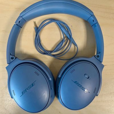 Sale Photo Thumbnail #288: Over-ear design with plush cushioned earcups, active noise cancellation, adjustable ambient modes, and up to 24 hours of battery life per charge. Supports both wireless Bluetooth pairing and wired audio using the included 3.5mm to 2.5mm audio cable shown.