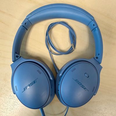 Sale Photo Thumbnail #285: Over-ear design with plush cushioned earcups, active noise cancellation, adjustable ambient modes, and up to 24 hours of battery life per charge. Supports both wireless Bluetooth pairing and wired audio using the included 3.5mm to 2.5mm audio cable shown.