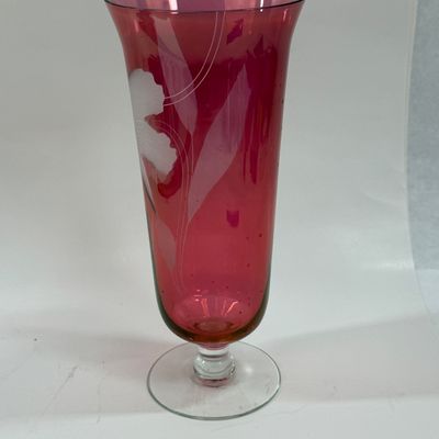 Sale Photo Thumbnail #118: Vintage ruby cranberry flash glass vase features a delicate white etched floral design. Good condition, approx. 10" tall.