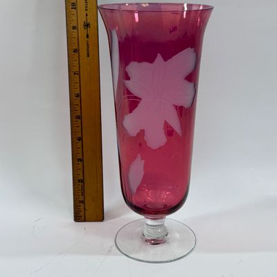Sale Photo Thumbnail #121: Vintage ruby cranberry flash glass vase features a delicate white etched floral design. Good condition, approx. 10" tall.