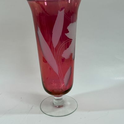 Sale Photo Thumbnail #120: Vintage ruby cranberry flash glass vase features a delicate white etched floral design. Good condition, approx. 10" tall.
