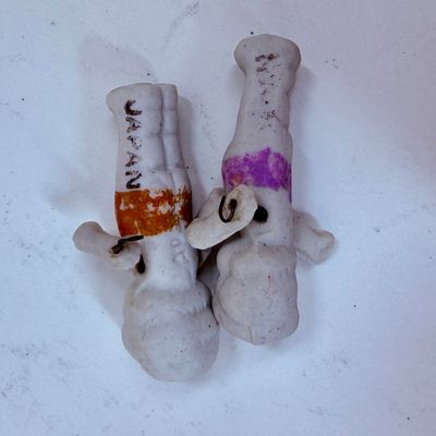 Sale Photo Thumbnail #485: Often called "penny dolls," "frozen Charlotte" dolls, or Kewpie dolls.  Commonly manufactured around the 1930s. The dolls frequently feature jointed arms attached with small metal wires, allowing them to move.T hey were often sold as carnival prizes or di