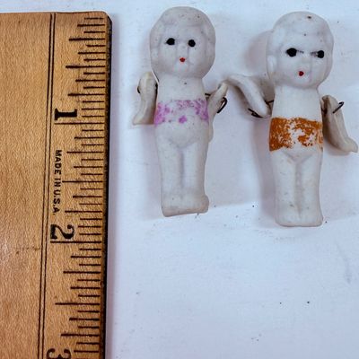Sale Photo Thumbnail #483: Often called "penny dolls," "frozen Charlotte" dolls, or Kewpie dolls.  Commonly manufactured around the 1930s. The dolls frequently feature jointed arms attached with small metal wires, allowing them to move.T hey were often sold as carnival prizes or di