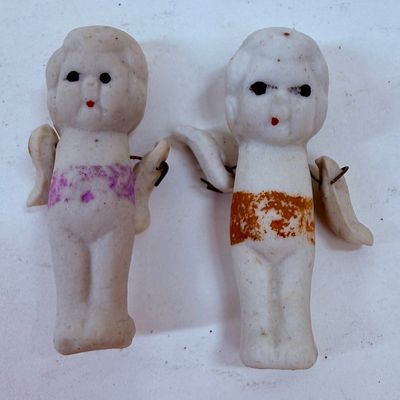 Sale Photo Thumbnail #482: Often called "penny dolls," "frozen Charlotte" dolls, or Kewpie dolls.  Commonly manufactured around the 1930s. The dolls frequently feature jointed arms attached with small metal wires, allowing them to move.T hey were often sold as carnival prizes or di