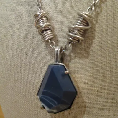 Kenneth Cole Chunky faux Lapis stone set in silver tone on a twisted artisan style chain