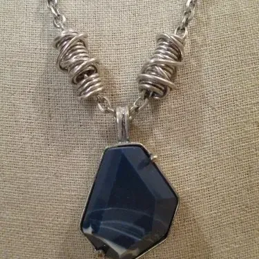 Kenneth Cole Chunky faux Lapis stone set in silver tone on a twisted artisan style chain