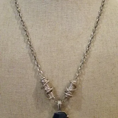 Kenneth Cole Chunky faux Lapis stone set in silver tone on a twisted artisan style chain
