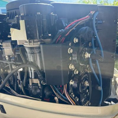 Sale Photo Thumbnail #32: Includes everything pictured, including Four Winns trailer. Johnson 150hp Ocean Pro outboard motor, production date 8/2000. Eighteen foot hull. The motor turns over, but is not firing. The engine cowling has a crack (pictured). This boat is pretty clean. 