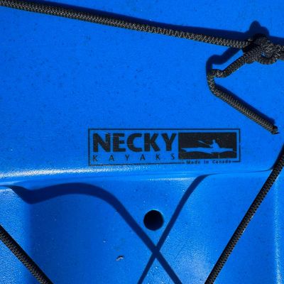 Sale Photo Thumbnail #84: Believed to be either the Dolphin or the Necky Spike. These are known for their unique flared hulls, deep lines, and excellent speed relative to comp. Measurement: 11’6”L. There is age related wear.