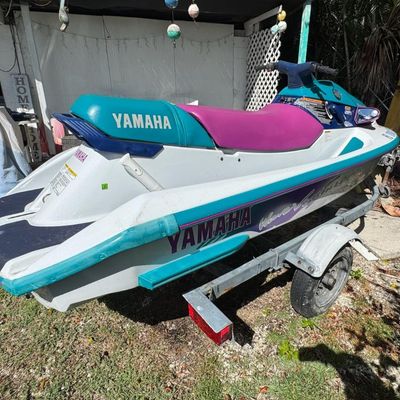 Sale Photo Thumbnail #112: Includes trailer. There is no title for the trailer. Model WVT700T. 701cc, 80hp. Not tested. VIN: YAMA1230D95. There is a minor scuff on the back.