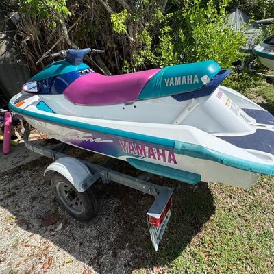 Sale Photo Thumbnail #107: Includes trailer. There is no title for the trailer. Model WVT700T. 701cc, 80hp. Not tested. VIN: YAMA1230D95. There is a minor scuff on the back.