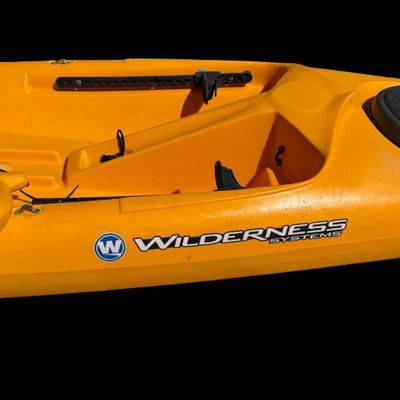 Sale Photo Thumbnail #124: Made by Wilderness Systems. This is a classic touring and fishing kayak, known for its speed and stability. Measurement: 16’L. General age related wear.