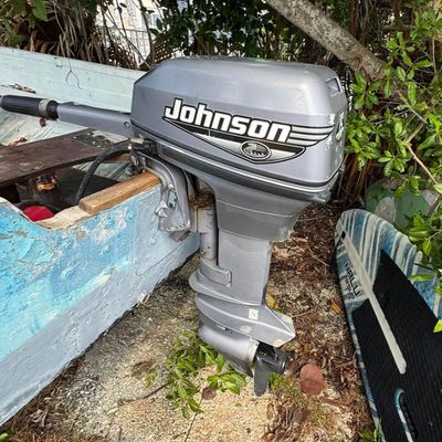 Sale Photo Thumbnail #131: Includes trailer. Johnson 15hp outboard motor. Motor is running at time of catalog. Boat VIN: FLZ1571371272. The motor has a production date of Sept. 1999.