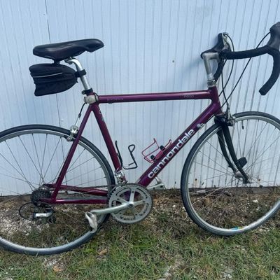 Sale Photo Thumbnail #142: Includes a Specialized hybrid and a Cannondale road bike. Two bicycles.