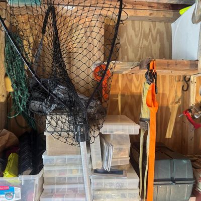 Sale Photo Thumbnail #172: Includes a car jack, cargo straps, a dive knife, fishing tackle, and more.