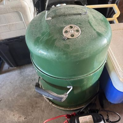 Sale Photo Thumbnail #207: Includes a Dyna-Glo smoker, coolers, a pop-up tent, a Johnson outboard motor, and more. Not tested.