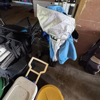 Sale Photo Thumbnail #205: Includes a Dyna-Glo smoker, coolers, a pop-up tent, a Johnson outboard motor, and more. Not tested.