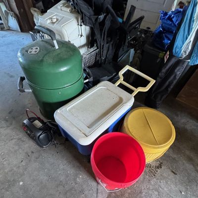 Sale Photo Thumbnail #206: Includes a Dyna-Glo smoker, coolers, a pop-up tent, a Johnson outboard motor, and more. Not tested.