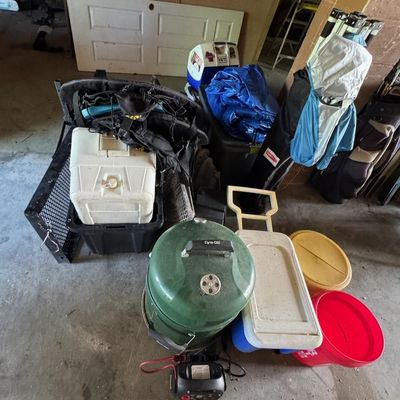 Sale Photo Thumbnail #204: Includes a Dyna-Glo smoker, coolers, a pop-up tent, a Johnson outboard motor, and more. Not tested.