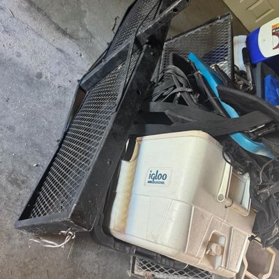 Sale Photo Thumbnail #208: Includes a Dyna-Glo smoker, coolers, a pop-up tent, a Johnson outboard motor, and more. Not tested.