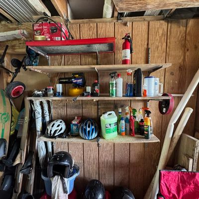 Sale Photo Thumbnail #213: Includes vintage water skis, golf clubs, a Generac GP5500 generator, gas cans, and more. The generator is running at the time of catalog.