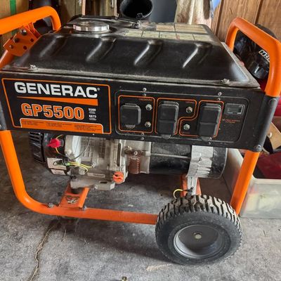 Sale Photo Thumbnail #211: Includes vintage water skis, golf clubs, a Generac GP5500 generator, gas cans, and more. The generator is running at the time of catalog.