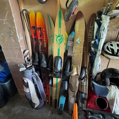 Sale Photo Thumbnail #212: Includes vintage water skis, golf clubs, a Generac GP5500 generator, gas cans, and more. The generator is running at the time of catalog.
