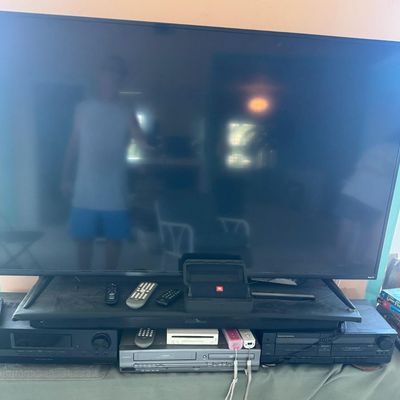 Sale Photo Thumbnail #322: Includes a 54” Roku television, a Magnavox VHS/DVD player, a Marantz Legacy Series cassette DA452, a Sony receiver, a JBL Bluetooth speaker, DVDs, a Wii console with two remotes, and more. Not tested.