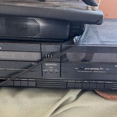 Sale Photo Thumbnail #325: Includes a 54” Roku television, a Magnavox VHS/DVD player, a Marantz Legacy Series cassette DA452, a Sony receiver, a JBL Bluetooth speaker, DVDs, a Wii console with two remotes, and more. Not tested.