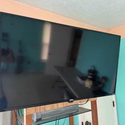 Sale Photo Thumbnail #336: Includes a 40” Roku television, a Magnavox VHS/DVD player, speakers, and more. Total of five pieces. Not tested.