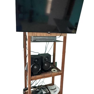 Sale Photo Thumbnail #335: Includes a 40” Roku television, a Magnavox VHS/DVD player, speakers, and more. Total of five pieces. Not tested.
