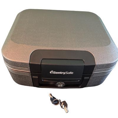 Sale Photo Thumbnail #340: Model CHW2021. This is a .28 cubic foot fire- and water-resistant chest safe. It is secured with a key lock. Includes two keys. Exterior dimensions: 15”L x 14”W x 7”D.