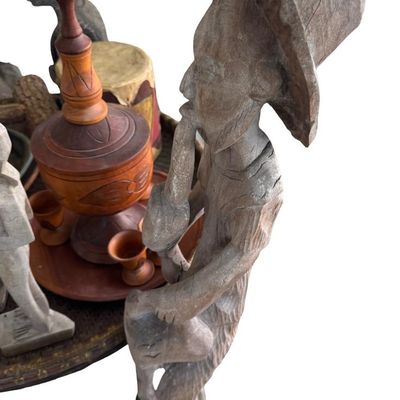 Sale Photo Thumbnail #389: Includes masks, statues, a drum, and a rattan table. Total of 15+ pieces.