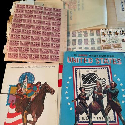 Sale Photo Thumbnail #394: Includes numerous U.S. and foreign stamps, along with sleeves and collector books.