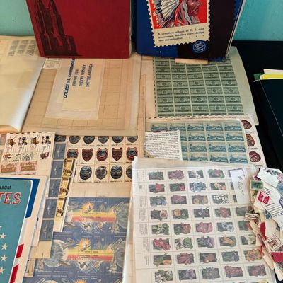 Sale Photo Thumbnail #395: Includes numerous U.S. and foreign stamps, along with sleeves and collector books.