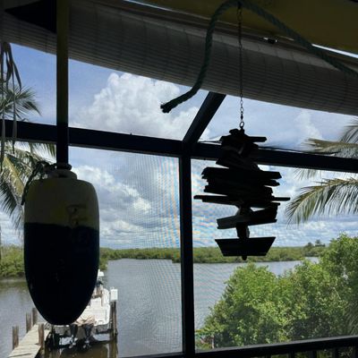 Sale Photo Thumbnail #403: Includes vintage crab trap buoys, whirligigs, painted coconuts, and more. Winning bidder must take these down.