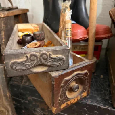 Sale Photo Thumbnail #36: Carved sewing machine drawers holding estate pipes and cigars