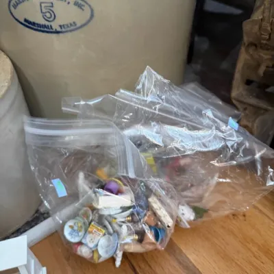 Sale Photo Thumbnail #39: Marshall Pottery 5 gallon crock with bagged dollhouse miniatures