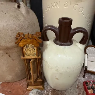 Sale Photo Thumbnail #50: Federal Law Forbids Sale stoneware jug and miniature clock