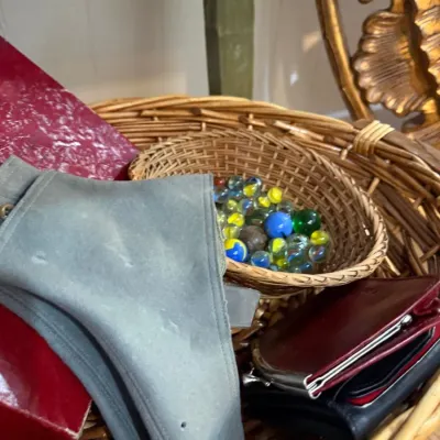 Sale Photo Thumbnail #67: Basket of vintage marbles and leather wallets