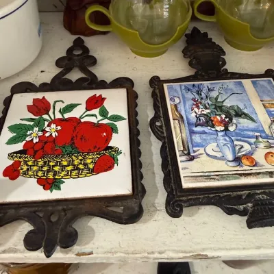 Sale Photo Thumbnail #101: Cast iron tile trivets, fruit and floral