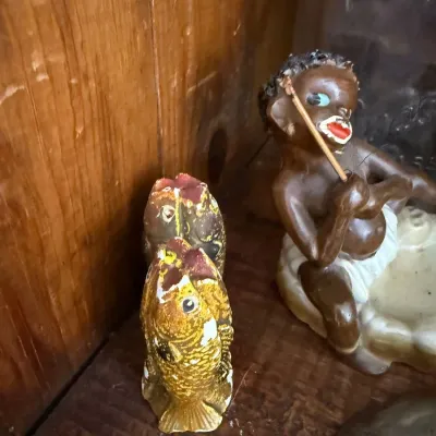 Sale Photo Thumbnail #154: Chalkware fish figurine and Black Americana piece